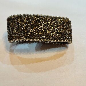 The Shyanne Women’s Crystal Snap Cuff Bracelet with crystal gems and studs.